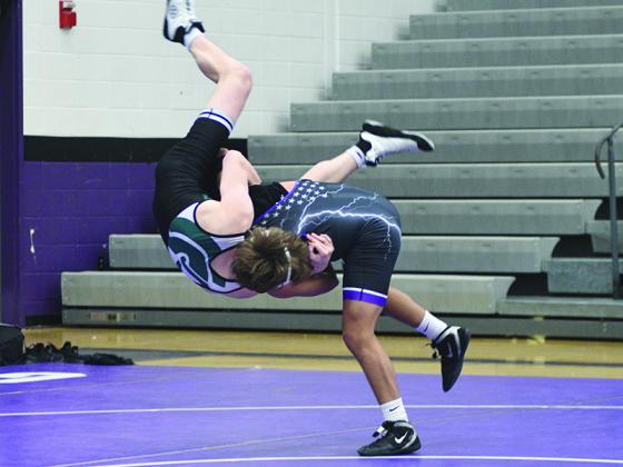 Gilmer junior Diego Jacinto (right) gently returns his North Hall opponent to Earth at last Saturday’s sectional wrestling tournament.
