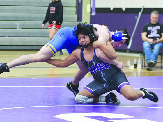 Gilmer High senior Domingo Escobar takes down his Etowah opponent during the Bobcat Duals last Thursday.