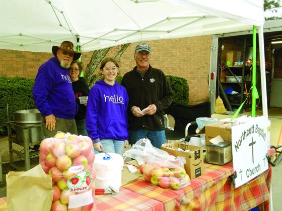 From left, Albert and Cindy O’Shields, Jaiden Bauer and Roger Bunnell are pictured at a soup stand they recently set up near a Red Cross and FEMA emergency relief center in Bowling Green, Ky. 