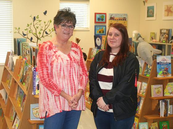 Retiring Gilmer Head Start Director Beth McArthur, left, is pictured in the school’s library alongside new Head Start Director Kristina Jones.