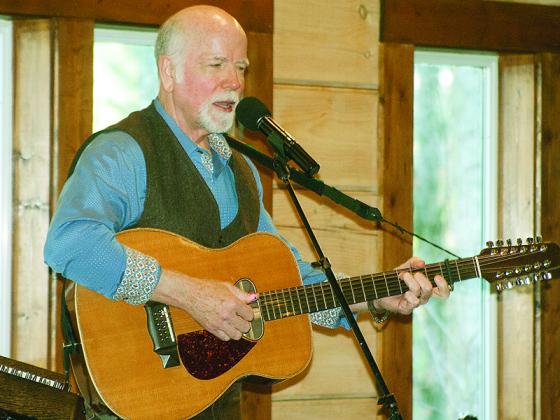 John McCutcheon is shown performing at the Craddock Center’s 2019 Songs & Stories event. 
