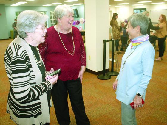 Anita Summers, center, and mother, Alice Davis, left, share a laugh with state Rep. Charlice Byrd, who represents Georgia House District 20, at a Gilmer County Library reception for Summer’s retirement as the Sequoyah Library System’s executive director.