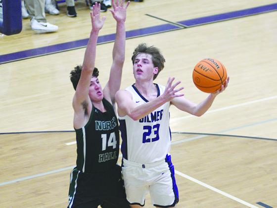 Gilmer’s Ethan Banks drives to the basket and scored 16 points versus East Forsyth last Tuesday.