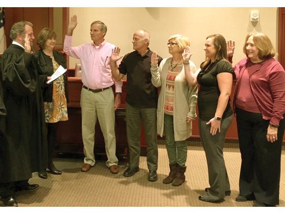 Judge John Worcester, left, swears in a past group of Court Appointed Special Advocates (CASAs) for the Appalachian Judicial Circuit. Appalachian CASA is among the local victim assistance organizations that could see reductions in federal VOCA funding this year. 