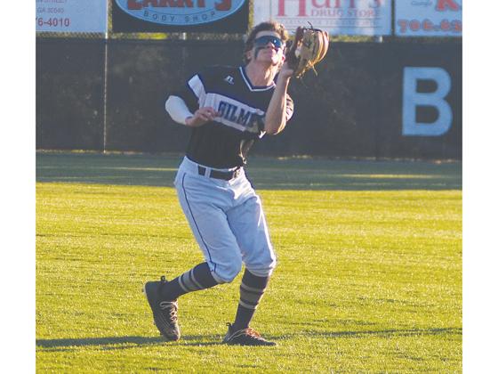 Gilmer High second baseman Austin Zabala ranges into shallow right field to catch a fly ball versus Pickens last Wednesday.