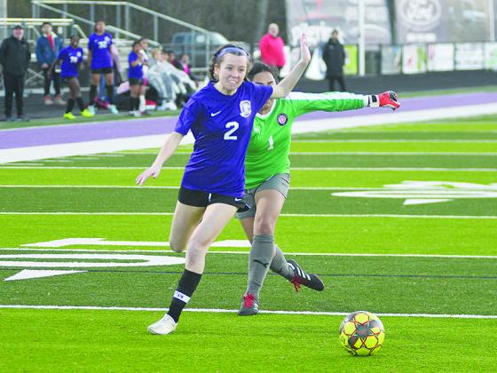 Gilmer senior Cadence Smith outmaneuvers the goalkeeper and draws a foul versus Dalton Academy last Friday. She made the ensuing penalty kick moments later.