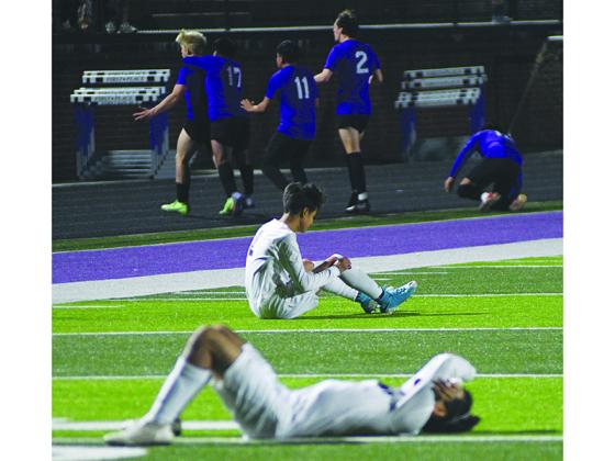 Two Cherokee Bluff Bears are strewn across Pettit Field as Gilmer Bobcats, from left in background, Julien Withrow, Miguel Lopez-Velasquez, Diego Jacinto and Connor Seim celebrate the win last Friday.