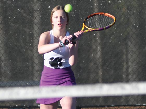 ilmer High singles tennis player Lady Cat Lyla Engle during a recent home match.