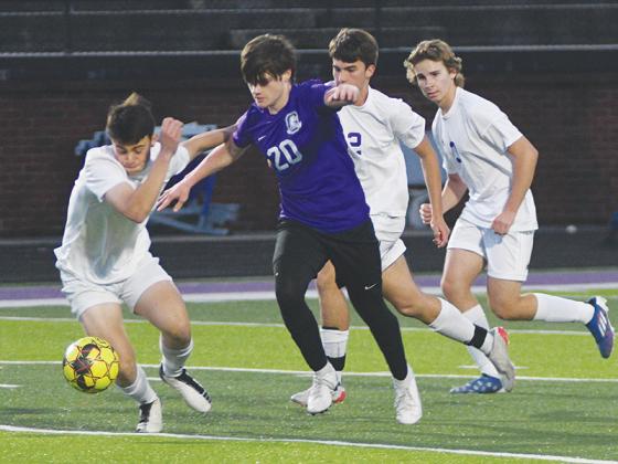 Gilmer High senior Nick Dean (20) makes his way past a host of Union County Panthers last Wednesday.