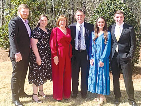 Michelle Penland is pictured center with family.