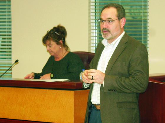 Gilmer County Elections Superintendent Scott Chastain, right, and Chief Registrar Tammy Watkins, back, lead a town hall to discuss moving the Big Creek polling place.