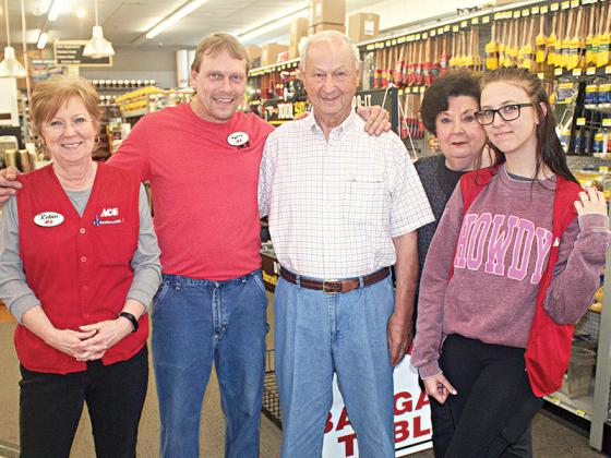 Former Ellijay Ace Hardware owner Mack Logan and wife, Dorothy, third and fourth from left, catch up with store employees Robin Tilley, Kenny Turner and Sierra Powell during a recent visit to the business the Logans ran for over 40 years.
