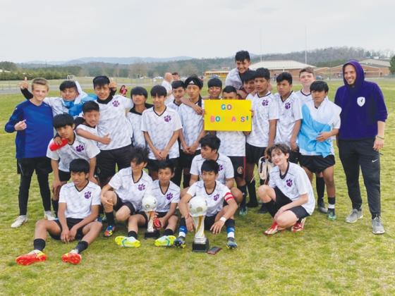 The Clear Creek Middle School Bobcats celebrate their Mountain League soccer championship after defeating Pickens 1-0 last Wednesday.