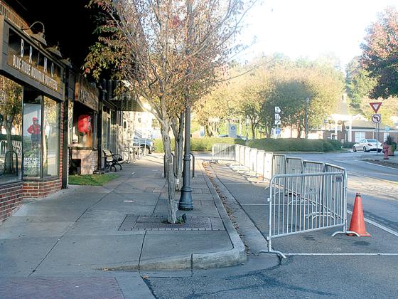 The Ellijay Downtown Development Authority is recommending that nine parallel parking spaces on River Street, which were temporarily blocked by metal barricades last fall, be permanently restricted, this time using decorative trough planters.