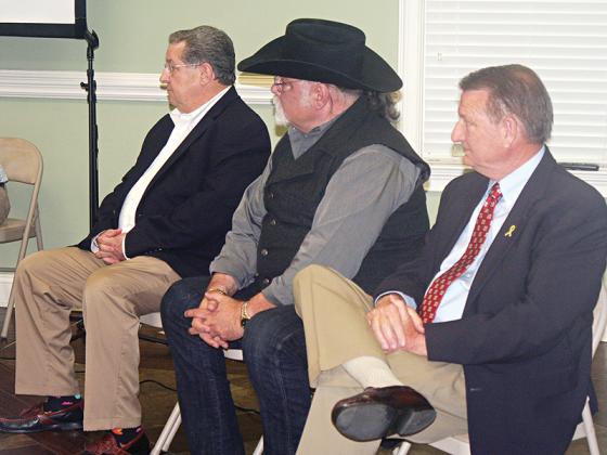 Gilmer County Post 2 Commissioner candidates, from left, John Marshall, Tom Whatley and Gary Engel await their turn at the podium during a Gilmer Chamber candidate forum held Monday evening. 