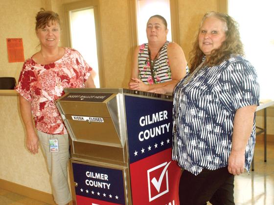 Gilmer County Chief Registrar Tammy Watkins, left, and voter registrar’s office employees Amanda Keith and Sherri Jones are pictured with the county’s absentee ballot dropbox, which will be used in the upcoming primary election. Georgia’s new voter law requires that the absentee ballot boxes be moved inside registration offices statewide. 