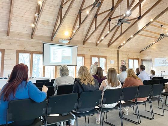 Ryan Swartz, of Highland Rivers Health, leads the Narcan training presentation at the Craddock Center. 