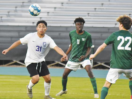 Bobcat senior Alex Lopez looks to gain possession versus Westminster in the first round of the state playoffs last Wednesday.