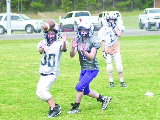 Clear Creek Middle School wrapped up its spring football practice last Friday. Much of the two weeks was spent honing fundamentals such as, above, pass defense, below right, firing out low off the line of scrimmage and, below left, making correct reads in the triple option.