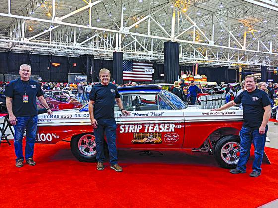 From left, James Thomas, Dennis Neal and Rex Davis are shown at a recent car show in Cleveland, Ohio, with Strip Teaser II, one of several dragstrip cars that once belonged to James’ dad, Bob Thomas. Dennis’ dad, Howard Neal, drove the car in races, while Rex’s dad, Larry Davis, built and tuned its inner workings.  