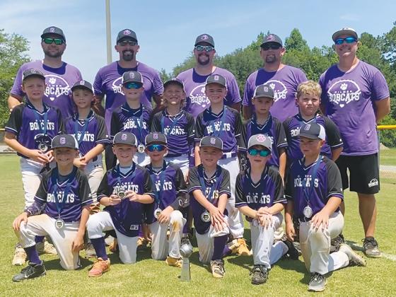 Gilmer’s 8U baseball all-stars and coaches gather around the Bobcats’ runner-up trophy from the Georgia Recreation and Park Association’s Class C Coaches Pitch State Tournament. The team was coached by Tony Keener, Brady West, Adam Pulliam, Nathan West and Jeff Thurman and players were Ty West, Parker Easley, William Phillips, Noah Keener, Miles Burnette, Caleb Fountain, Wyatt Brandon, Liam Bernard, Brantley Pulliam, Lance West, Payden Thurman, Mac Boyd and Luke Bland.  