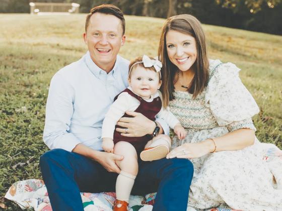 Gilmer High School’s new girls head soccer coach Adam Palmer is joined by wife Betsy and daughter Hadley.