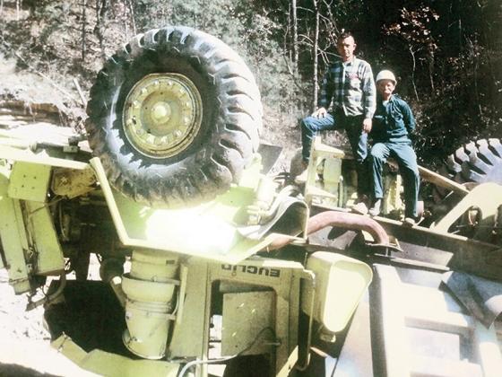 The overturned dump truck that ran head-on into a bulldozer on a “haul road” back in the day of the construction of Carters Dam. (U.S. Corps of Engineers photo)