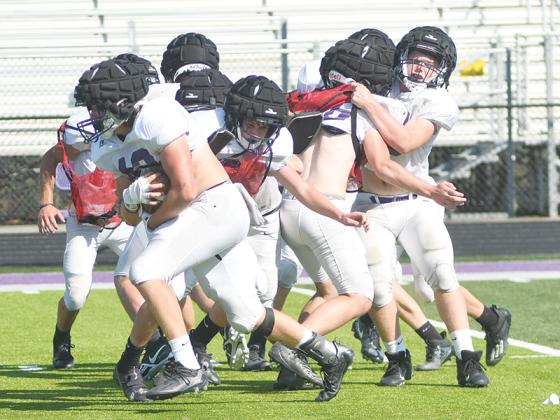 Gilmer senior fullback Brock Titus picks his way through the defense in the spring, and the Bobcats will return to full pads next Monday.
