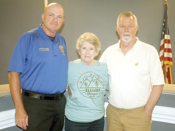 Soon-to-be-former East Ellijay resident MyKey Cook, center, says goodbye to Police Chief Larry Callahan, left, and City Planner Mack Wood, right. 