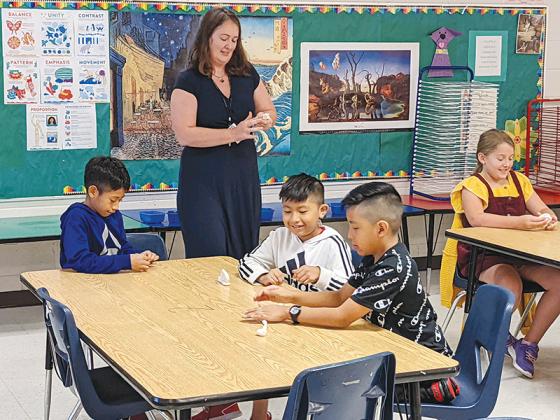Mountain View Elementary art teacher Misti Foster and students Axel Carrillo Godinez, Domingo Loarca Mateo and Moises Reynoso Bautista