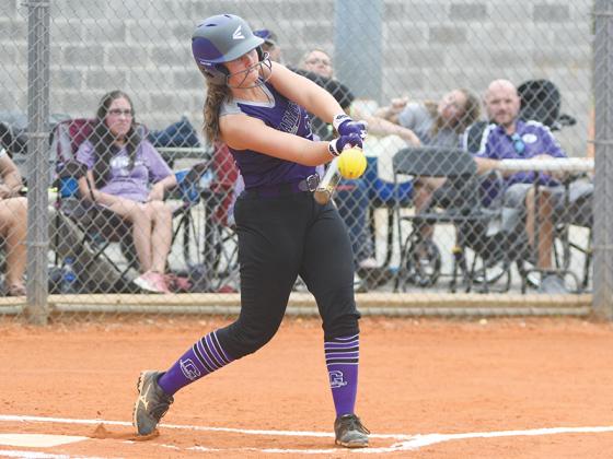 Clear Creek Middle School’s Emma Cagle gets her bat on the ball for a hit versus White County last Wednesday.