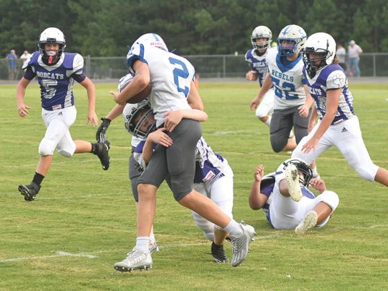 Clear Creek seventh grader Hunter Newhart makes a tackle earlier this season and scored a touchdown for the Bobcats in their win over White County.