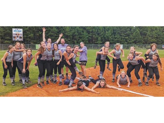 Clear Creek Middle School softball players and coaches take a minute to celebrate their come-from-behind victory over the Union County Panthers last Tuesday.