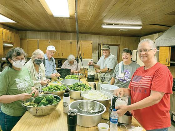 Volunteers with the Cherry Log Community Action Group prepare to can chow-chow for the upcoming festival. Pictured, from left: Laurel Johnson, Bonnie Ozaki, Jerry Norton, Betty Davenport, David Alsobrook, Dale Alsobrook and Sandra Wieser. (Photo by Bill Ozaki, Cherry Log Community Action Group)