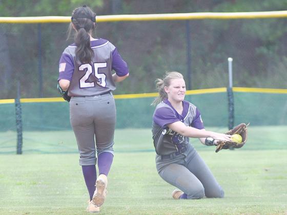 Gilmer’s sure-handed center fielder Jacie Bennett makes a sliding catch just behind second bases versus Rockmart last Saturday at the Dalton invitational. Below from left, Lily Fortune delivers a pitch and third baseman Phoenix Addie fields a ground ball. Fortune pitched against Dalton to begin the tournament and earned the win.