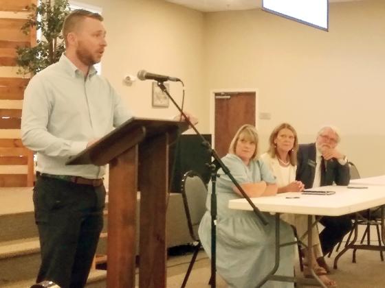 Reece Sanford, Ellijay Downtown Development Authority (DDA) chairman, left, speaks during a DDA information session on workforce housing last Tuesday. Pictured, seated, are DDA members Sandy Ott and Melinda Hadden and Jeff Ledford, of the Georgia Realtors Association. 