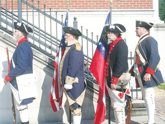 A color guard comprised of members of the Sons of the American Revolution Blue Ridge Mountains Chapter stands at ready during the dedication event. Pictured, from left: Stephen Weaver, Jared Ogden, Sid Turner and Mike Sutila.