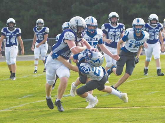 Clear Creek Middle School halfback Douglas Callihan delivers a stiff arm in week one and tallied a rushing touchdown in the Bobcats’ 14-0 win versus Union County last Tuesday.