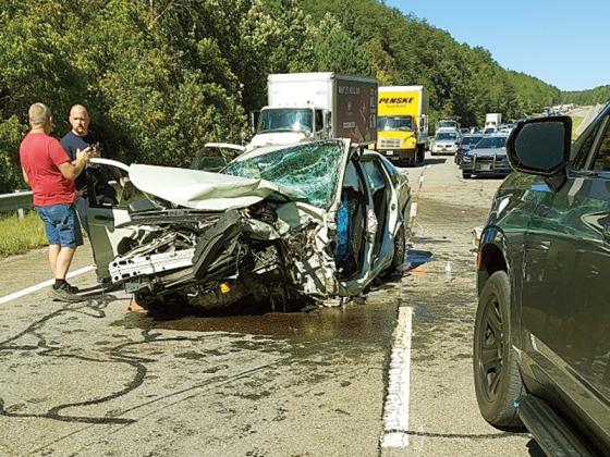 The southbound lanes of Hwy. 515 were blocked Sept. 23 as law enforcement officials worked an accident caused by three people fleeing East Ellijay officers. One person died and two others were seriously injured in the crash. Georgia State Patrol is investigating the accident and charges are pending.