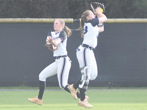 Gilmer High School left fielder Alaina Miltiades hauls in a line drive in front of center fielder Jacie Bennett.