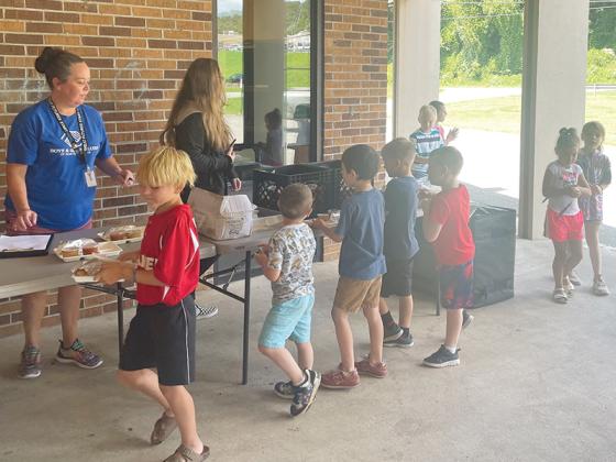 The county’s youth pick up meals at the Boys and Girls Club of Gilmer County, which was one of eight sites where food was provided during June and July.