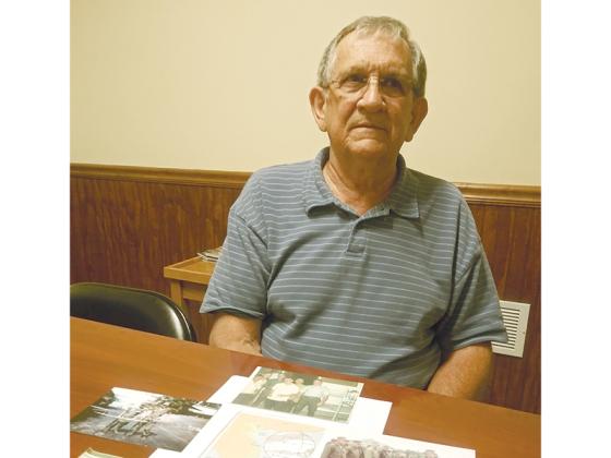 Thomas Payne, who served as a U.S. Marine in the Vietnam War, shows the few photos he has left from his tour of duty there. He was med-evacked by helicopter when he suffered a bullet wound through his hip on March 12, 1968.