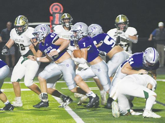 Gilmer fullback Brock Titus (43) leads the way for halfback Hunter Watkins (7) after he receives blocks from linemen Hershel Defoor (58) and Blane Banks (54) versus Wesleyan last Friday.
