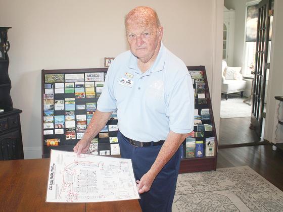 Gilmer Chamber Information Specialist Joe Sewell shows a map of how the upcoming Georgia Apple Festival will be laid out. 
