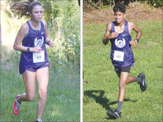 From left, Gilmer High cross-country runners Helana Garland and Eder Martinez compete at last Tuesday’s 5K.