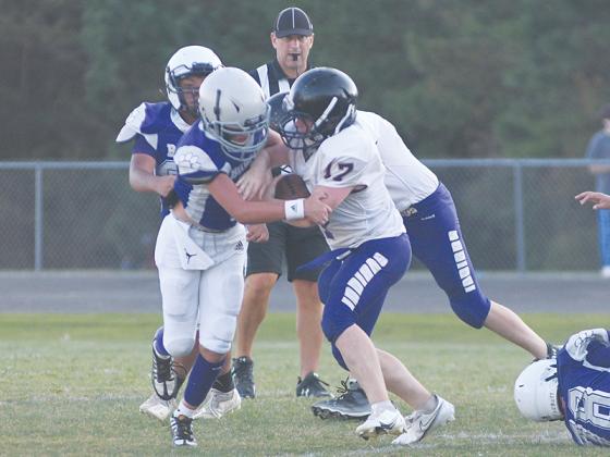 Clear Creek seventh grader A.J. Callihan makes a tackle, and he intercepted a pass versus Dawson County last Tuesday. Offensively, he accounted for two touchdowns in the Bobcats’ 35-7 victory.