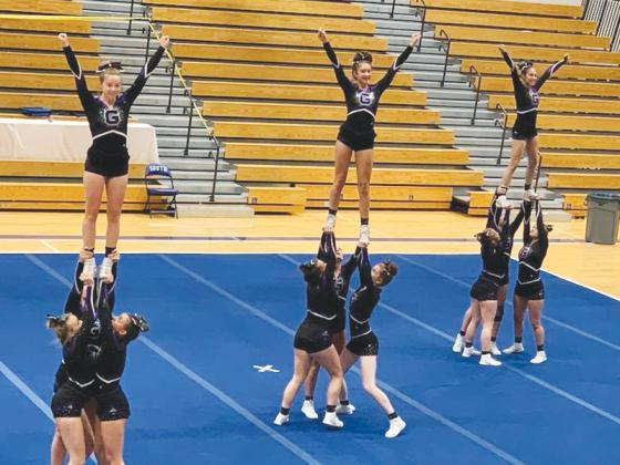 Above, Gilmer High School’s competition cheerleaders perform their routine Oct.15. They will attend the region competition next Saturday at Morgan County High School. A top 16 finish in Class 3A is needed to qualify for state.
