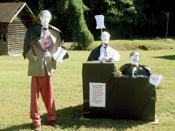 The Clark and Clark Attorneys scarecrow team is ready for Halloween at Harrison Park. 