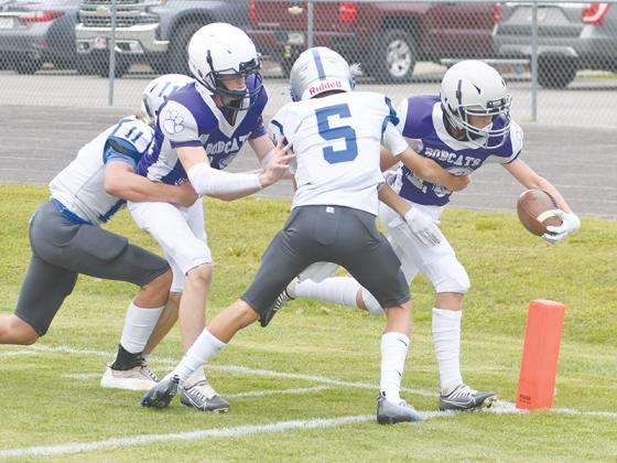 Clear Creek eighth-grade halfback Mason West extends the ball over the goal line and scored two touchdowns to go with an interception on defense versus Pickens last Tuesday.