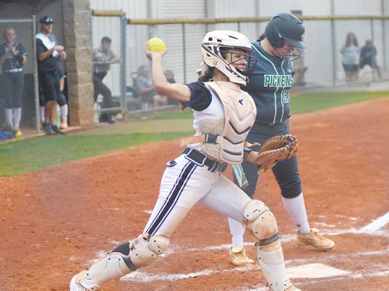 Gilmer High senior catcher Maddie Wright makes a throw to first. She was a four-year starter for the Lady Cats and wrapped up her GHS career Monday.